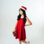Vietnamese girl carrying gift box in red Christmas shirt Cô gái việt nam mang hộp quà áo đỏ giáng sinh