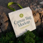 free canvas bag laying on stones mockup 17122025