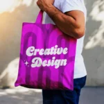 Minimalist Tote Bag Mockup Held by Man Outdoors