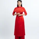 Model tết áo dài đỏ wearing a red ao dai for Tet 20012026