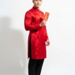 Model tết áo dài đỏ wearing a red ao dai for Tet 20012026c